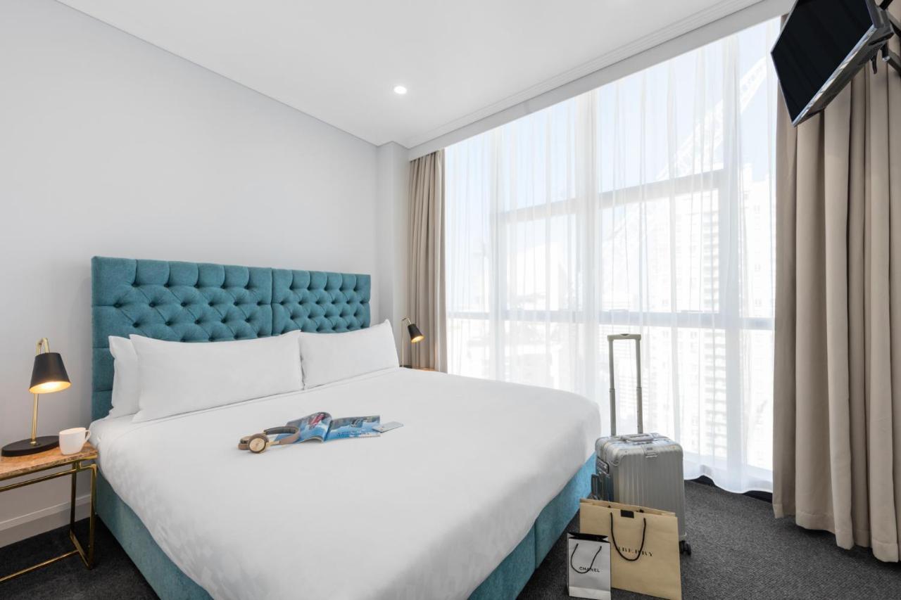 Meriton Suites Pitt Street, Sydney Zewnętrze zdjęcie A bedroom at the hotel
